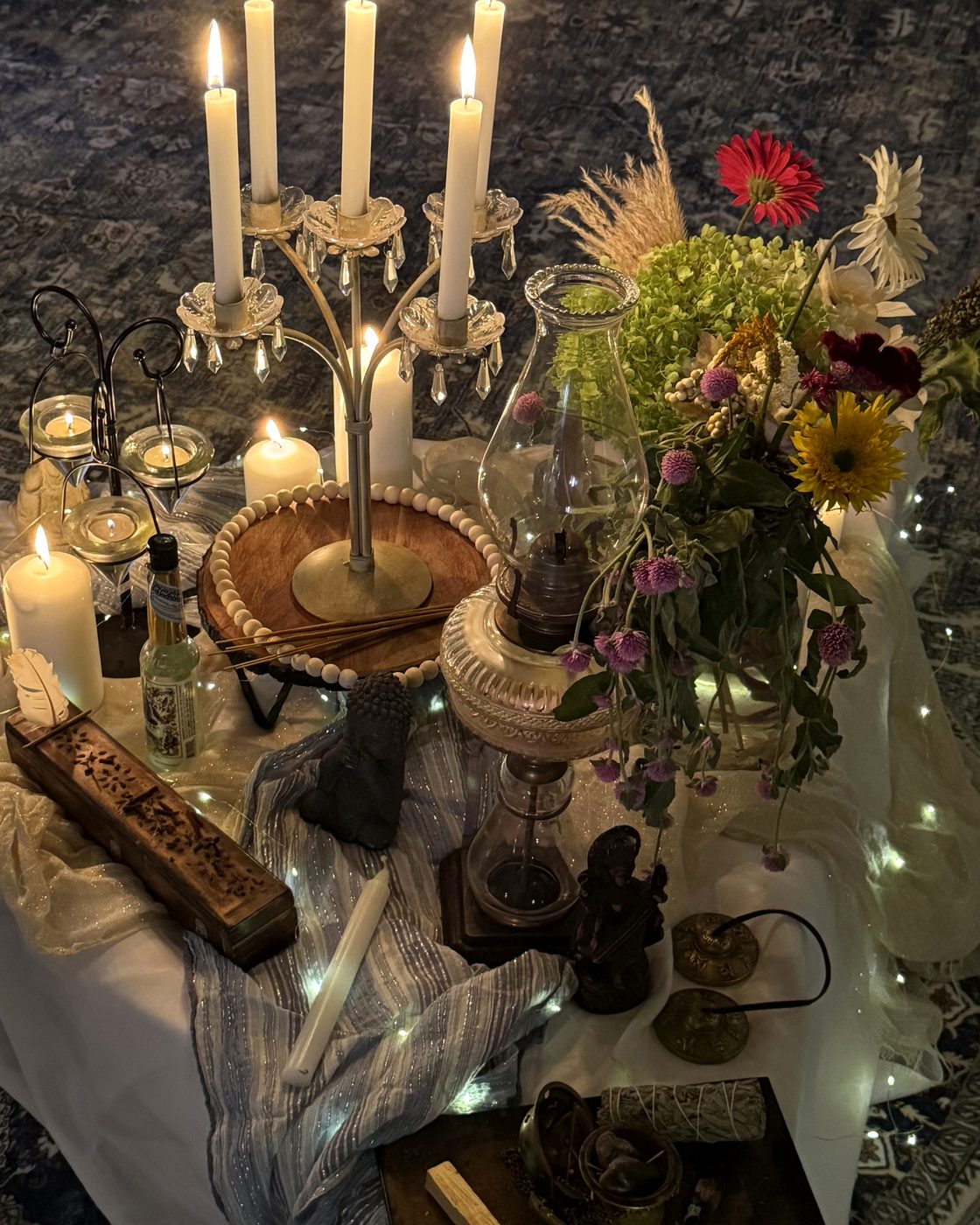 The altar from the Simply…Woman Retreat — candlelight, sage, and the tools of coming home to yourself